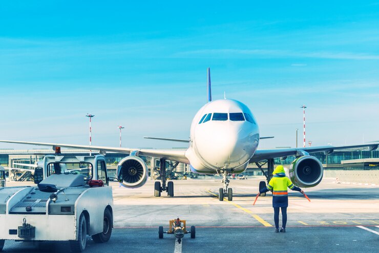 airplane at airport with freight